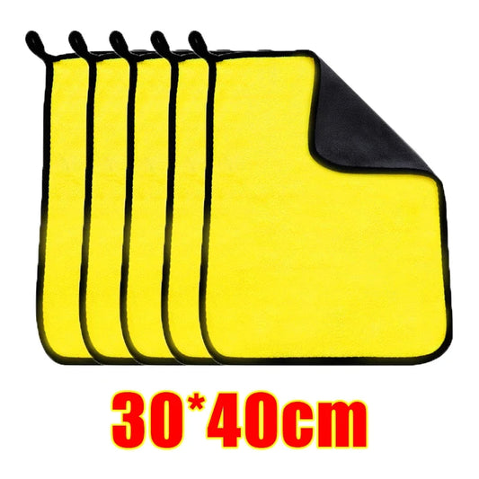 Set of yellow cloths with black edges, displayed against a white background.