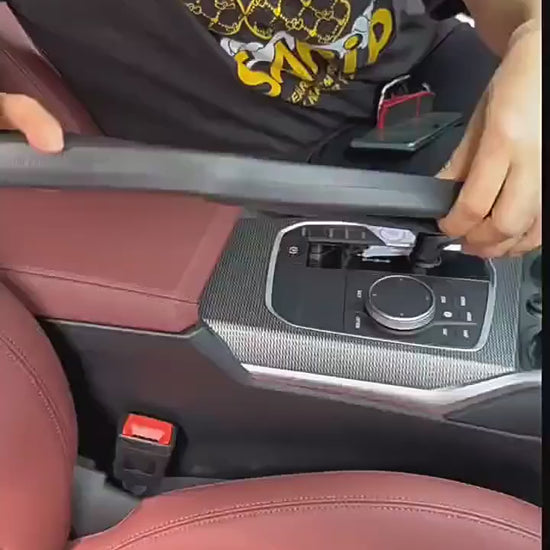 Universal car seat gap filler organizer in black PU leather installed between seat and center console