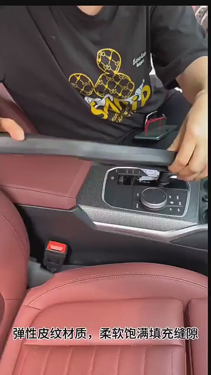 Universal car seat gap filler organizer in black PU leather installed between seat and center console